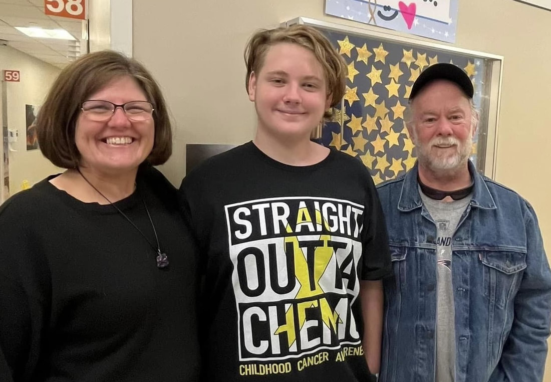 Cancer survivor, Brady, with his mom and dad.